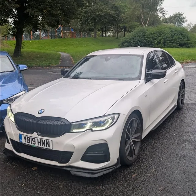 White BMW 3 Series M Sport parked after a coding session