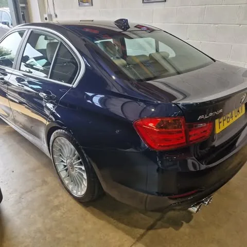Dark blue BMW Alpina B3 saloon in a garage