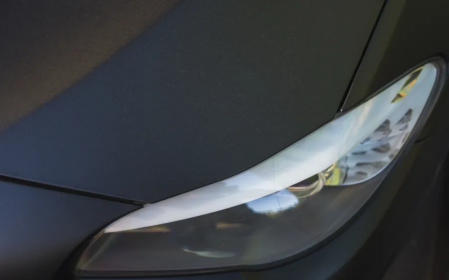Modern LED headlight on a black car